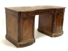 Victorian mahogany twin pedestal desk, inverted break front over one long and two short drawers, arc