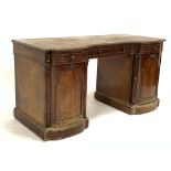 Victorian mahogany twin pedestal desk, inverted break front over one long and two short drawers, arc