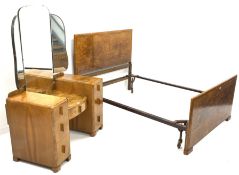 Early 20th century figured walnut dressing table, shaped mirror back over four drawers, raised on bl