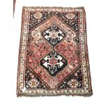 Persian design red ground rug, pole medallion enclosed by stylised decoration to border, 16cm x 116