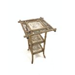 Late Victorian bamboo framed plant stand, three tiers inset with tiles depicting Shakespearian scene