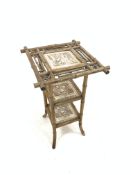 Late Victorian bamboo framed plant stand, three tiers inset with tiles depicting Shakespearian scene