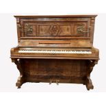 19th century figured walnut Baderbein upright piano, with decorative floral brass sconces, iron fra