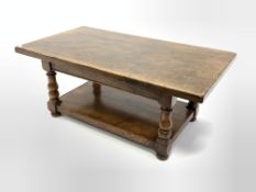 18th century style solid oak coffee table, turned supports united by under tier, 122cm x 68c, H50cm