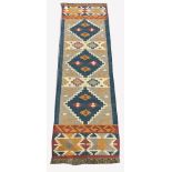 Flat weave Kilim runner rug, with three geometric lozenge medallions on beige field, 260cm x 81cm
