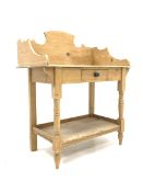 Victorian pine washstand, with raised back over single drawer, raised on turned supports united by u