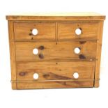 Victorian waxed pine chest fitted with two short and two long drawers, with white ceramic pull handl
