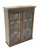 20th century glazed mahogany bookcase, with astragal glazed doors enclosing two adjustable shelves,