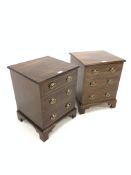 Pair of mahogany bedsides, with hinged tops revealing plain interiors, over three faux drawers, rais