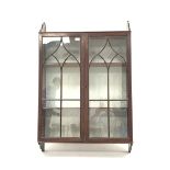 19th century mahogany wall hanging display cabinet, with Gothic arched tracery glazed doors enclosin