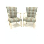 Pair of French style painted hardwood open armchairs, upholstered in striped floral fabric, raised o