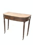 Georgian mahogany fold over tea table, the bow front top with reeded edge, raised on spiral turned s