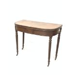 Georgian mahogany fold over tea table, the bow front top with reeded edge, raised on spiral turned s