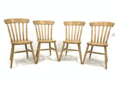 Set four beech wood Windsor style comb back dining chairs, with shaped seats raised on ring turned s