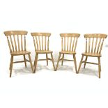 Set four beech wood Windsor style comb back dining chairs, with shaped seats raised on ring turned s