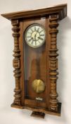 Walnut and beech cased Vienna style wall clock, with white dial with Roman chapter ring, twin train