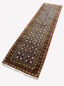 Persian Veramin ground runner rug, with repeating floral decoration enclosed by multi line border, 2