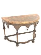 Victorian walnut demi lune console table, well figured top over Gothic arched apron, raised on turne