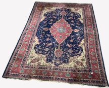 Large Persian design blue ground carpet, with lozenge medallion on blue field enclosed by stylised g