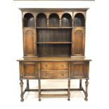 18th century style oak dresser, two open shelves over two arched panelled cupboards, fitted cutlery