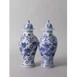 An Attractive Pair of Blue and White Baluster Vases and Covers, Kangxi Period, Qing Dynasty