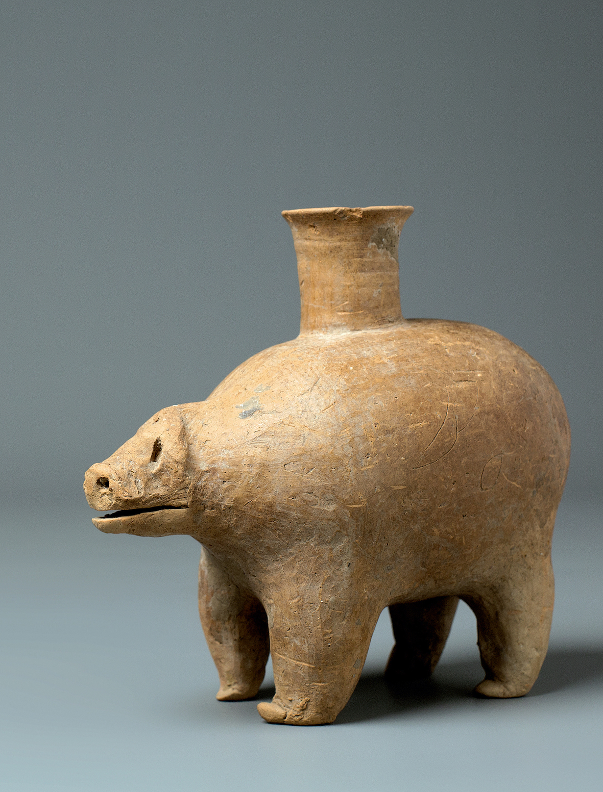 A Red Pottery Jar In The Form Of A Bear, Gansu Province, Qijia Culture (2050-1700 Bc)