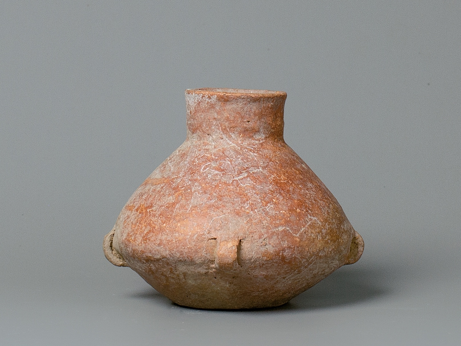 A Red Pottery Vase With Small Handles, Hongshan Culture (4500-3000 Bc)