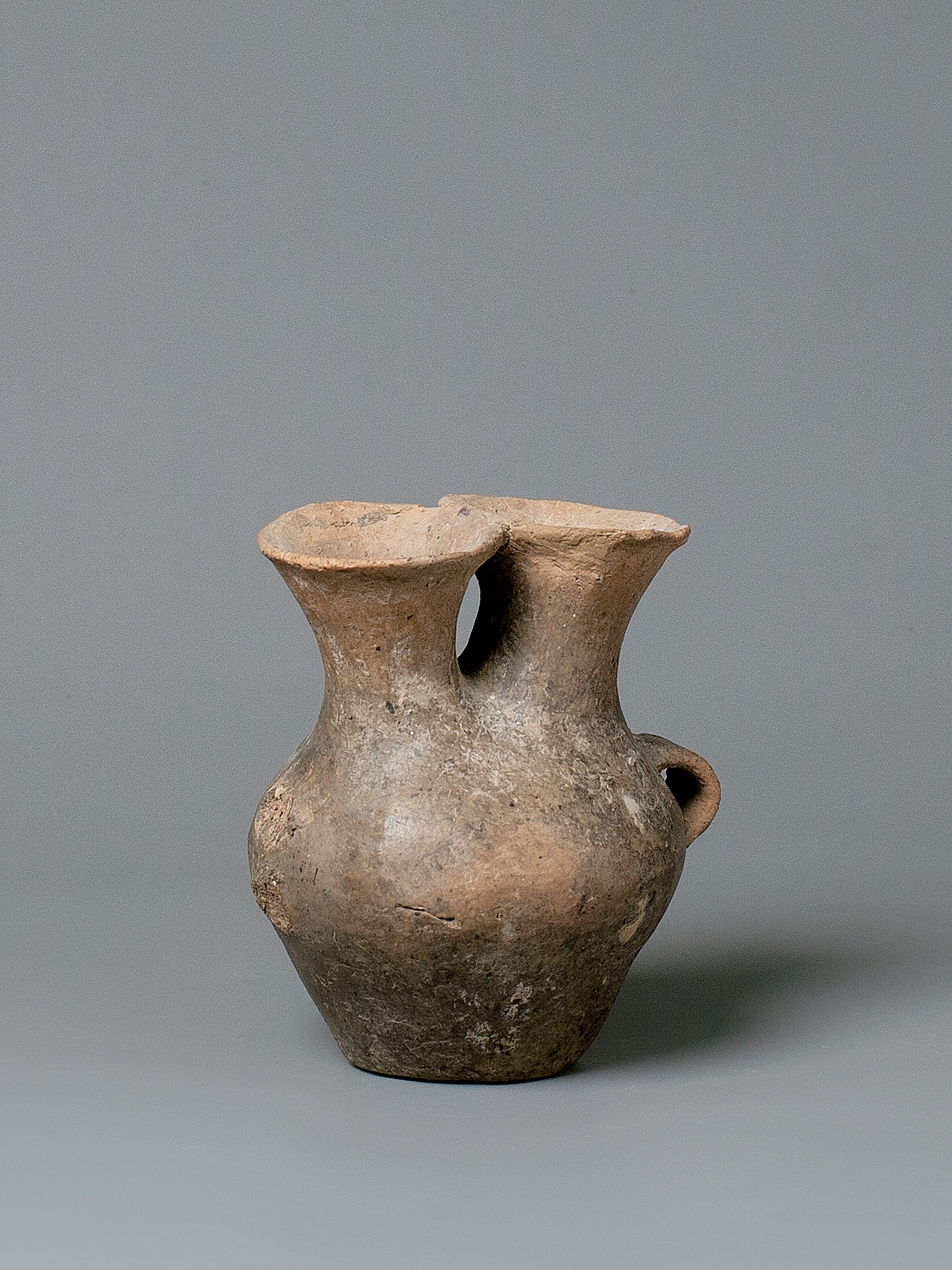 A Buff-Red Pottery Vase With Double Neck, Hongshan Culture (4500-3000 Bc)