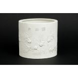 Chinese pencil pot in marked white (biscuit)porcelain with a decor in relief of [...]