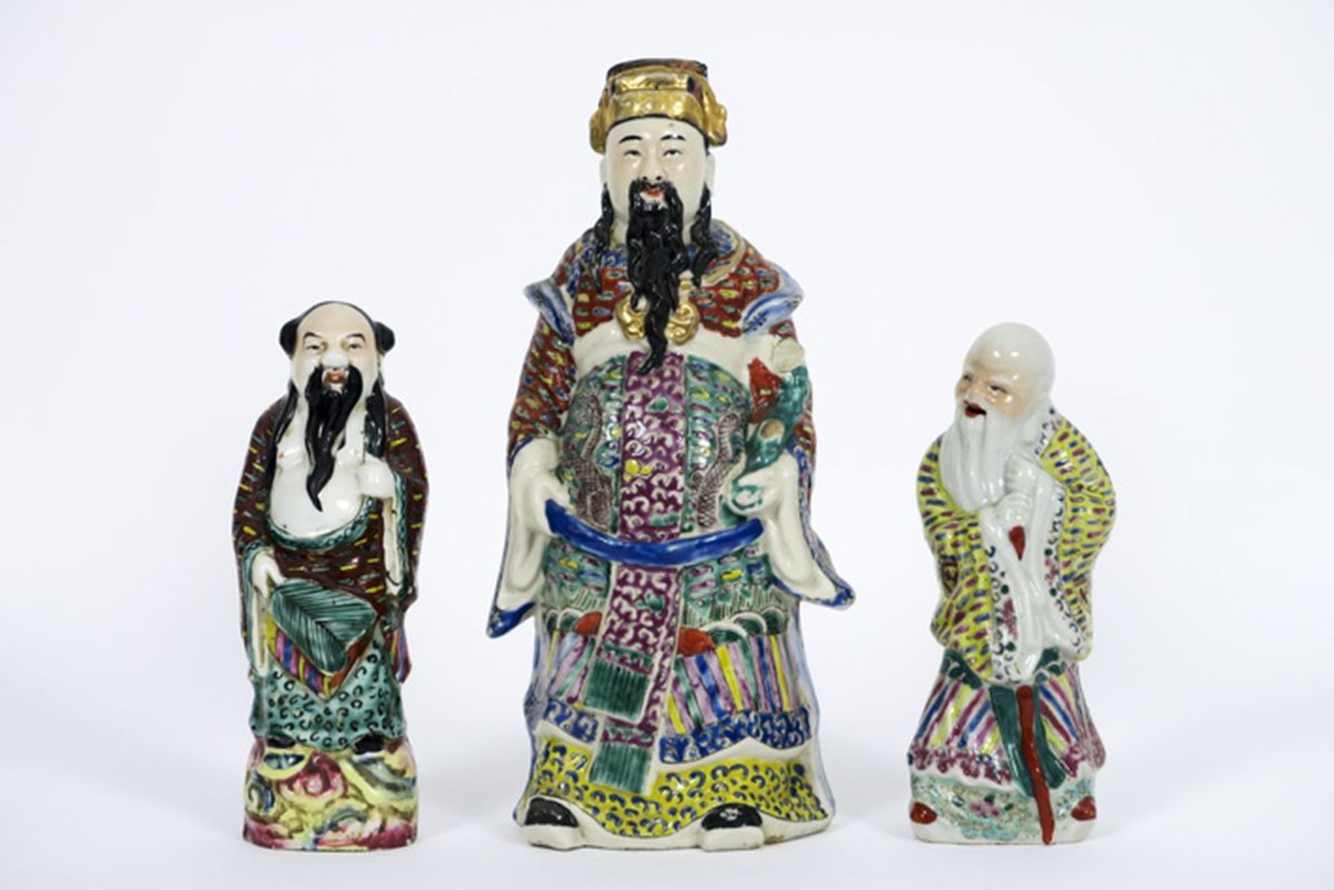 three Chinese "Sage" sculptures in porcelain with polychrome decor - - Lot van [...]