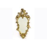 mirror with an antique, guilded Louis XV style frame with cupids - - Spiegel met [...]