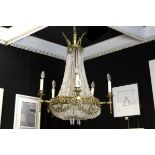 antique neoclassical chandelier in guilded bronze (with ram's heads) and crystal - [...]