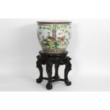 Chinese fishbowl in porcelain with 'Famille Rose' decor with birds in a garden sold [...]