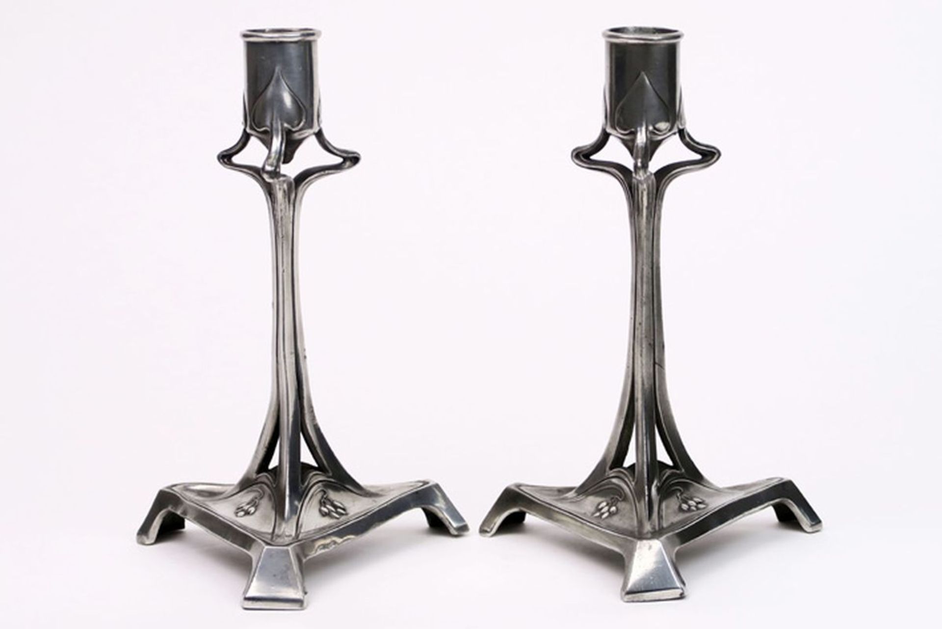 pair of illegibly marked French Art Nouveau candlesticks with whiplash ornamentation [...]