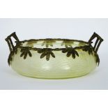 Art Nouveau bowl in glass with iridiscent color and with a mounting in guilded bronze [...]