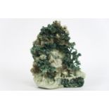 Chinese jade sculpture with a animated landscape with a reading god in a cave - - [...]