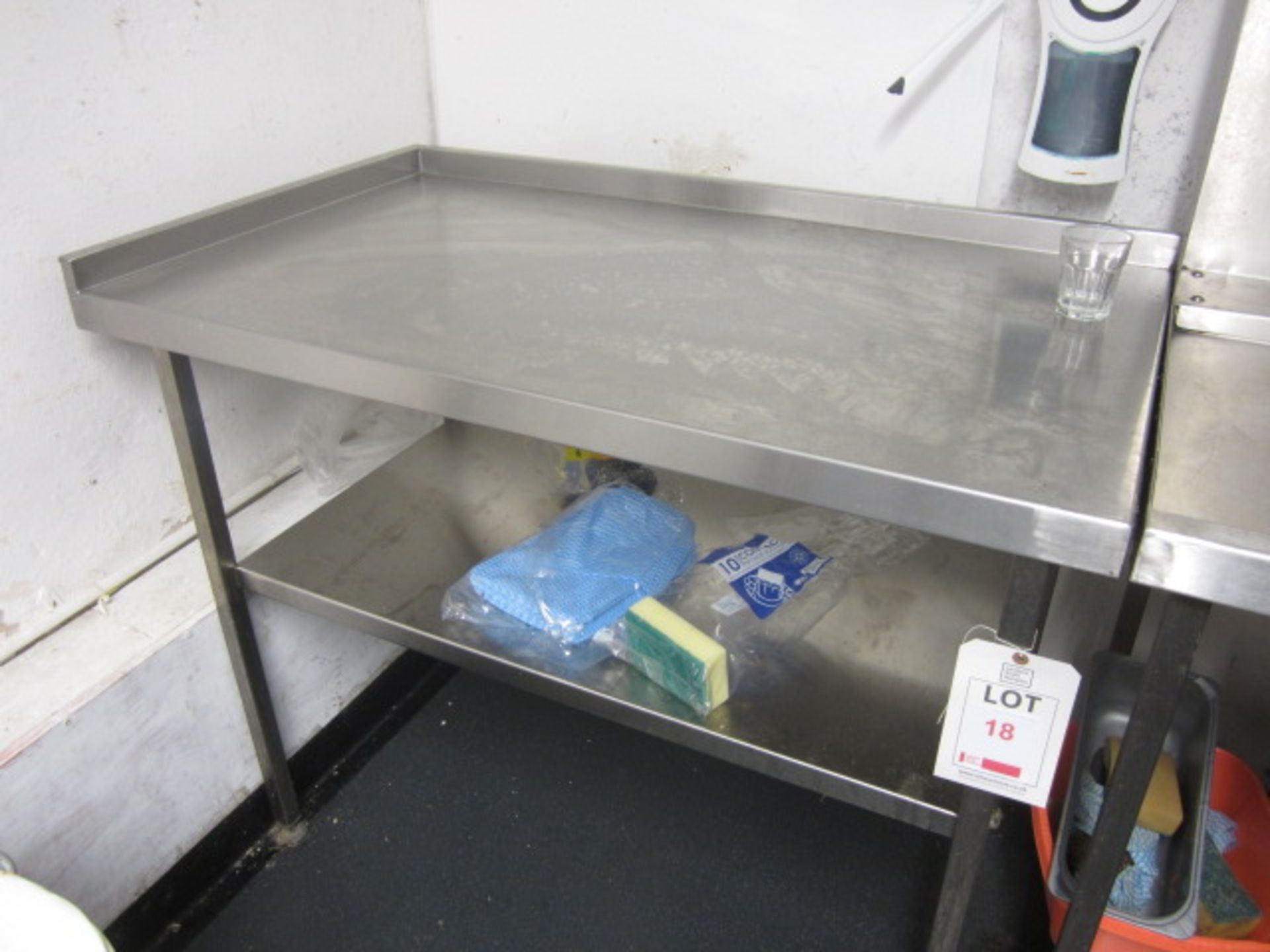 Stainless steel food preparation work surface with undershelf, approx. size: 1200mm x 700mm.