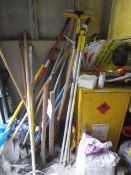 Quantity of assorted tools including spades, pick axes, rakes, paint roller, hole borer, window