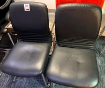 Two black leatherette & chrome cantilever chairs