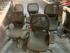 Five black cloth with mesh back swivel & tilt office chairs with chrome legs