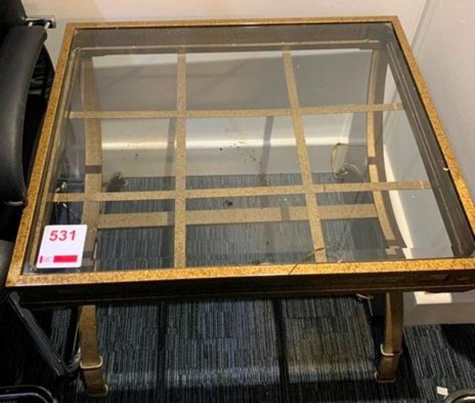 Glass top metal framed coffee table
