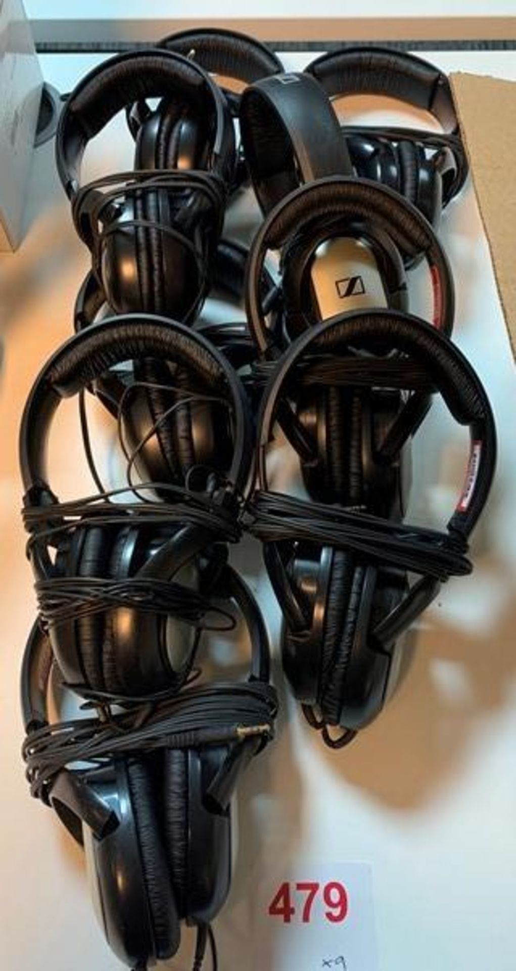 Nine sets of Sennheiser HD201 headsets