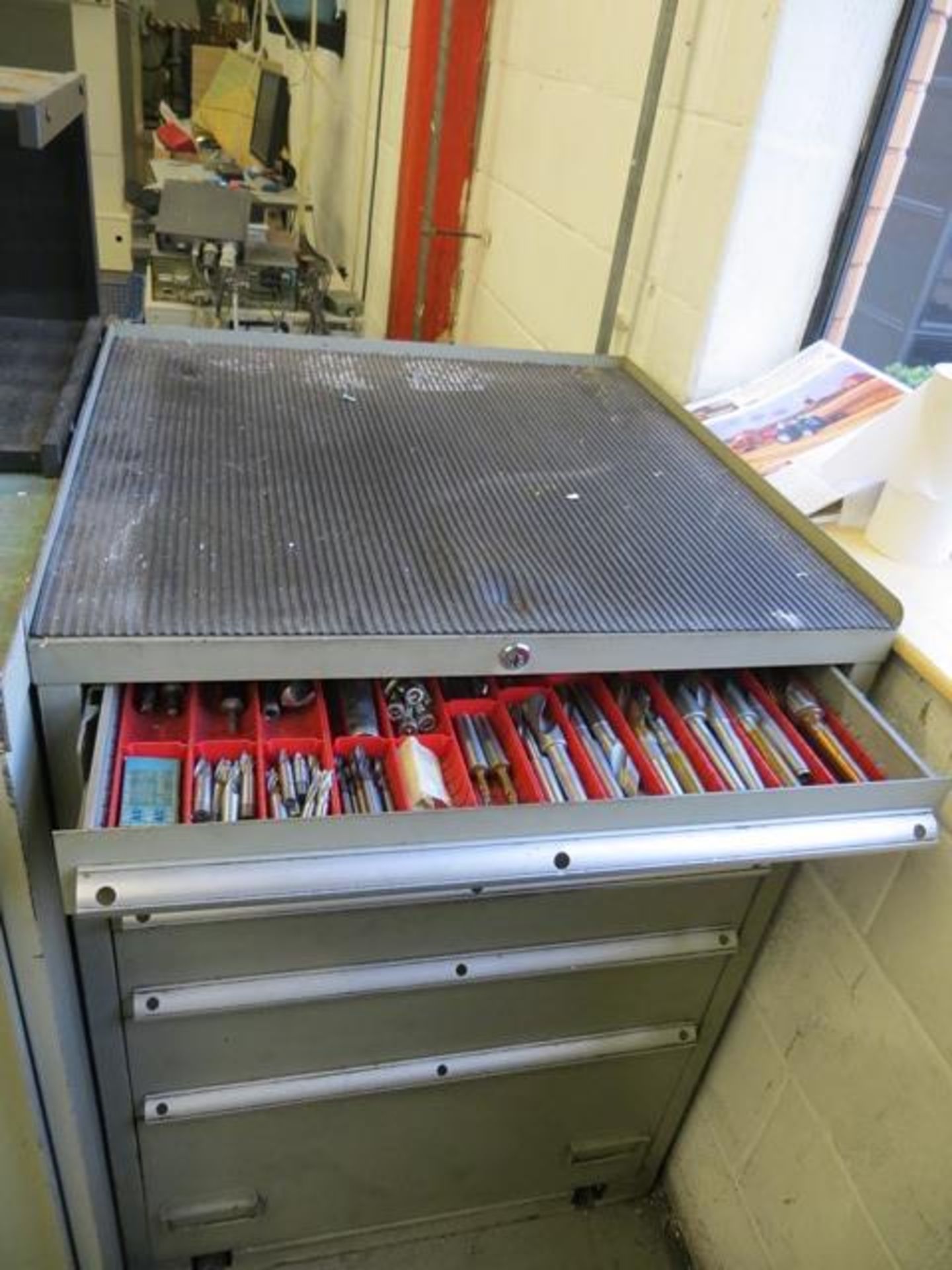 Six drawer tool chest c/w large quantity of tooling, cutters, & clamping accessories as lotted