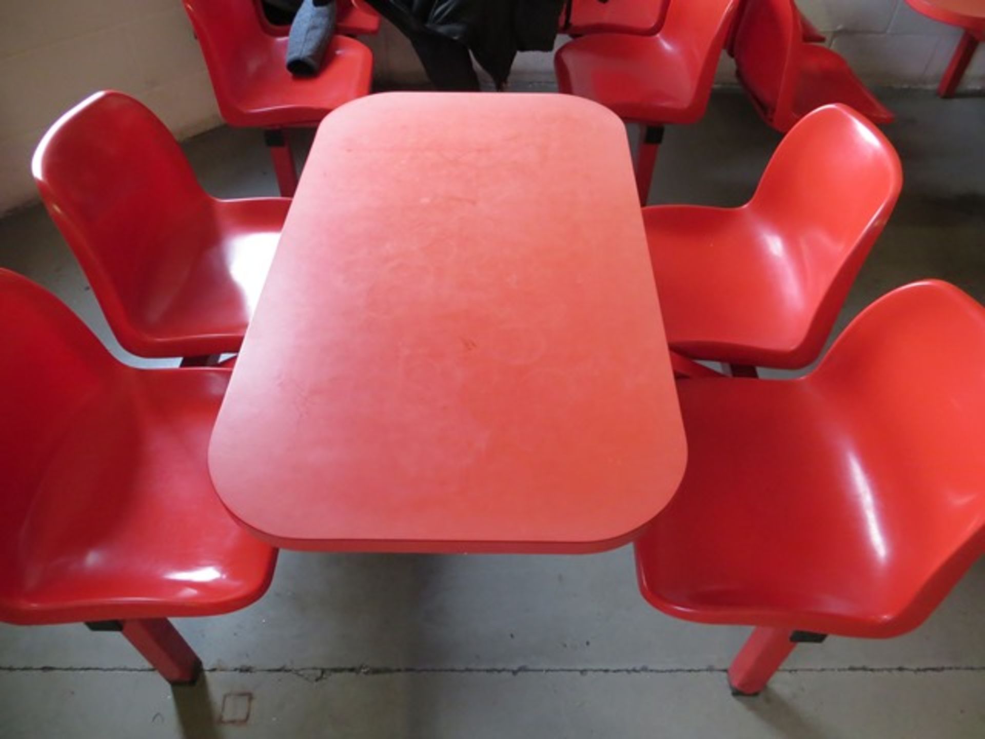 Three 4 seat red canteen table and chairs