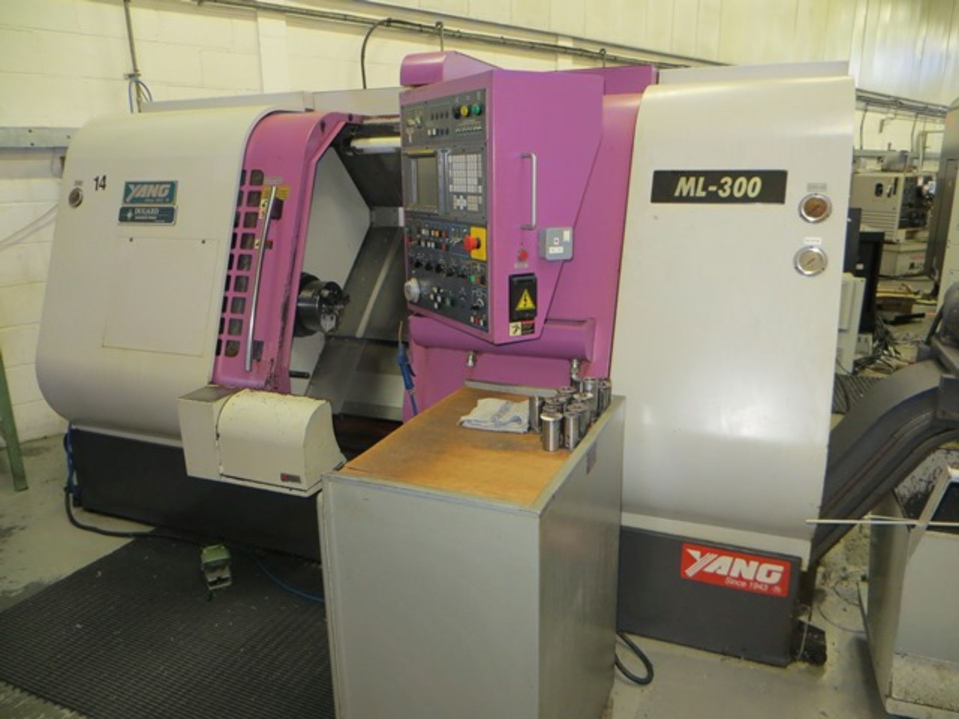 Yang ML-300 CNC lathe with control and Fonge residue discharge conveyor Year: c.2000 c/w two tool