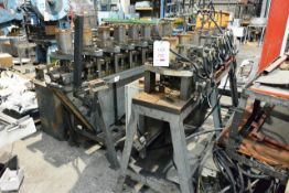 Two unbadged various table mounted 7 and 8 head, through feed hydraulic press punch, approx table