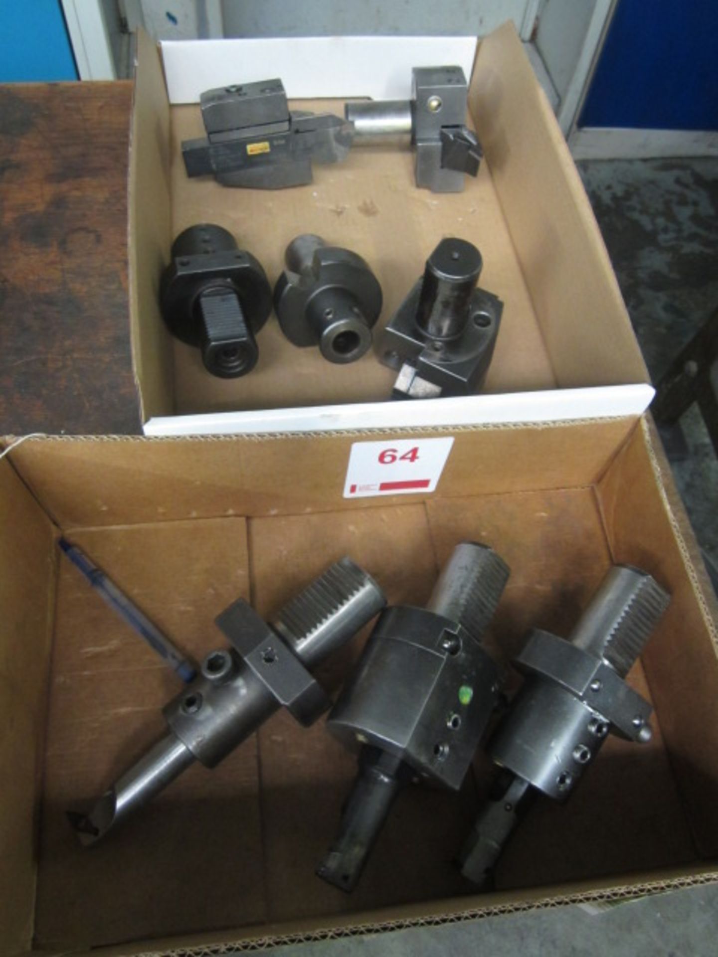 Two boxes of tool holders and fitted tooling, where fitted