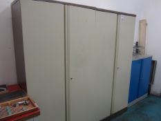 Three various twin door storage cabinets (as lotted)