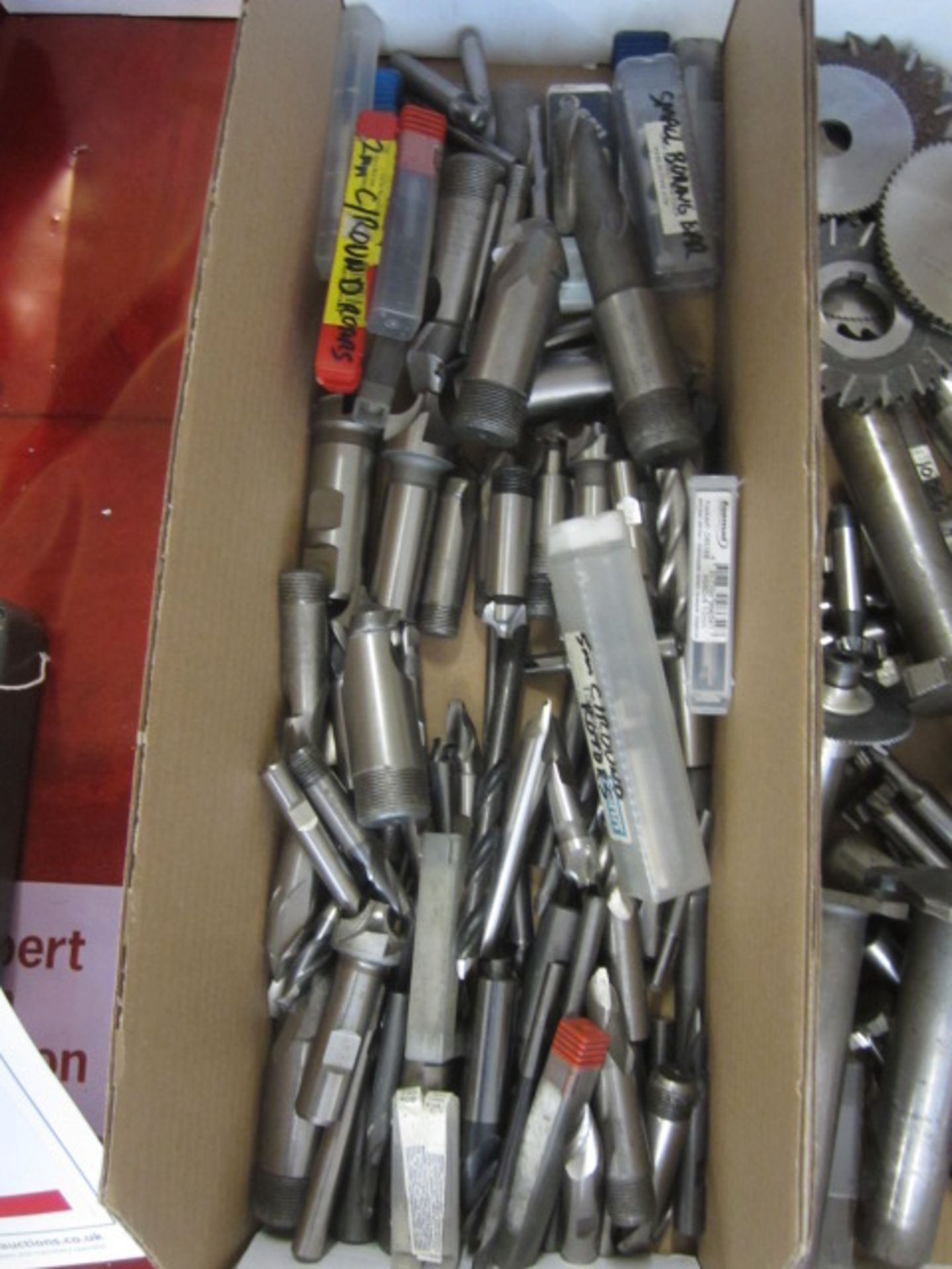 Box of assorted HSS tooling to include drill bits, cutters, borers, end mills, etc.