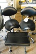 Two black leather effect mobile chairs and stool